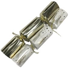 three wrapped christmas crackers tied with gold ribbon