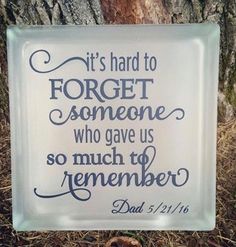 a glass sign that says it's hard to forget someone who gave us so much to remember