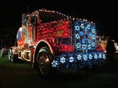 a large semi truck decorated with christmas lights