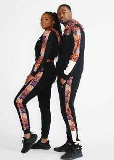 Style#AM4007BONK Take your leisure look to the next level with our Faraji joggers in black/orange navy kente. Made with the most comfortable french terry fabric, you'll want to wear these every day. African print side stripes add flair to these joggers, which can be perfectly paired with the Tumo zip-up hoodie. Shop the matching items here. Description: African print side stripe White color-blocked panel at pant leg Functional drawstring at the waist Gold drawstring details Rib knit at cuff 2 si Modern African Clothing, African Couple, Hoodie Couple, Athleisure Joggers, African Print Tops, African Outfits, Gym Apparel, Dresses African, Gold Paisley