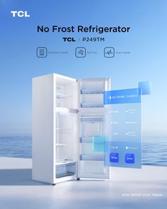 an open refrigerator sitting on top of a white floor next to the ocean with no frost refrigerator