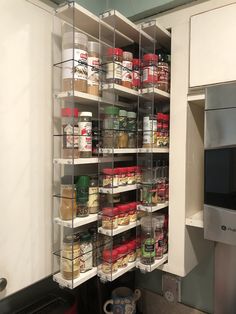 an organized pantry with lots of food in it