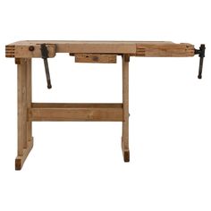 a wooden workbench with two tools on it's legs and one drawer open