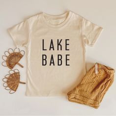 "Lake Babe" is part of our timeless collection. This shirt is a modern and minimal design tailored to all kids. Ultra-soft, 100% Cotton Top. The shirt is a unisex fit, true to size. All our apparel is printed in-house by hand with eco-friendly, non-toxic, water-based inks. Modern Screens, Sibling Shirts, Toxic Water, Sister Shirts, Kids Graphic Tees, Screen Printing Designs, Spring Shirts, Vacation Shirts, Big Sister