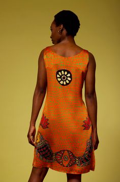 ACD23 - Nirvana (Orange/ Rust) Enter a room or outdoor event with the bold and vibrant colors of this orange/peach dress. The wearable art so distinct in red, blue, and green accents elevates this sleeveless dress to quality and beauty not found in any store. The combination of the life energy chakra, the uplifting birds, fish, and lotus blossom petals bring the energy and style you deserve to your active lifestyle. Relaxed and comfortable, you may wonder if you're even wearing a dress! The Slee Red Silk Festival Dress, Festival Sleeveless Silk Dress, Sleeveless Silk Festival Dress, Party Dress With Vibrant Orange Print, Vibrant Multicolor Dresses For Festivals, Vibrant Multicolor Festival Dresses, Fitted Orange Dress With Vibrant Print, Vibrant Orange Fitted Dress, Vibrant Fitted Orange Dress