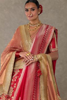 Red lehenga with separate cancan skirt, adorned with Son-chidiya, Haath-phool, Neel-Kamal, Shajara motifs in dori, multicolor thread, sitara, moti kaam work and hemline embellished with embroidered haathphool border and edged with kinari. Paired with embroidered padded blouse and brocade woven dupatta in Haathphool border and anar buti all over and gold foil printed tissue dupatta.
Components: 5
Pattern: Embellished, Embroidery
Type Of Work: Dori, thread, sitara, moti
Neckline: V neck
Sleeve Typ Red Sets With Zari Work For Traditional Ceremonies, Red Embroidered Anarkali Set For Traditional Ceremonies, Traditional Red Dupatta For Reception, Embroidered Red Sharara For Traditional Ceremonies, Red Traditional Wear With Intricate Embroidery For Ceremonies, Red Traditional Wear For Reception, Red Embroidered Traditional Anarkali Set, Red Motifs Anarkali Set For Wedding, Traditional Red Choli With Cutdana