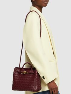 Find BOTTEGA VENETA Small Andiamo Leather Top Handle Bag on Editorialist. Height: 20cm Width: 25cm Depth: 10cm. Strap drop: 50cm. Handle drop: 6cm. Fixed strap. Single top handle. Magnetic closure. Gold-colored metal hardware. One internal zip pocket. One internal patch pocket. Bonded Intrecciato leather lining