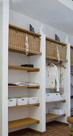 the inside of a clothing store with shelves and baskets