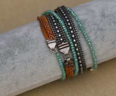 "This wrap bracelet features a lovely mix of crystal, silver beads and braided leather bracelet. A versatile wrap bead bracelet that can be easily worn with other accessories, especially boho ones. Different shades and different elements will make for a super cool gift for any woman who likes fashionable boho-chic jewelry. Product details: --------------------- Materials: *Leather *Turquoise crystal chez rondelle beads *silver-plated brass chain Measurements: *The bracelet length is 39.3\" / 1 m Bohemian Silver Hand Wrapped Braided Bracelets, Silver Bohemian Braided Bracelets, Bohemian Braided Bracelets With Silver Beads, Silver Bohemian Crystal Bracelet For Festivals, Silver Bohemian Braided Bracelet With Beads, Silver Beaded Bohemian Braided Bracelet, Silver Bohemian Braided Beaded Bracelets, Bohemian Silver Wrap Bracelet With Faceted Beads, Silver Beaded Bohemian Wrap Bracelet