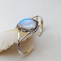 925 Sterling Silver Handmade Cuff Bracelet Gemstone - Blue Flashy Rainbow Moonstone Stone Shape - Fancy Colour - White Colour with Blue/Rainbow Fire Cut - Plain Cabochon Gemstone Size - 27*17 mm QTY - 1 piece. # Please send us your message in conversation if you have any questions or need more quantity of any particular item . Adjustable Moonstone Bracelet, Fine Jewelry Cabochon Bracelets As Gift, Adjustable Moonstone Jewelry Gift, Adjustable Moonstone Jewelry For Gift, Spiritual Moonstone Bangle Jewelry, Bohemian Moonstone Bracelet, Spiritual Moonstone Bangle, Bohemian Sterling Silver Bangle With Gemstone, Sterling Silver Moonstone Bracelet Gift