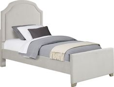 a bed with a white headboard and foot board on it's side, in front of a white background