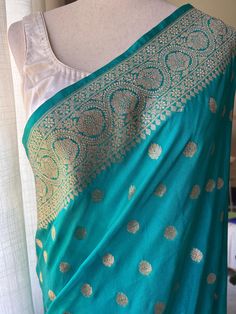 Pretty Pastel Sea Green Shade in Georgette Katan Saree Pico and Fall done. Saree comes with zari blouse piece. Note: Blouse in mannequin is a fashion suggestion, display purpose only Fitted Katan Silk Dupatta For Wedding, Fitted Wedding Saree With Zari Weaving, Wedding Katan Silk Fitted Dupatta, Fitted Katan Silk Dupatta For Celebration, Fitted Wedding Saree With Motifs, Fitted Katan Silk Saree For Wedding, Fitted Celebration Saree With Motifs, Fitted Katan Silk Choli For Weddings, Fitted Lehenga With Zari Weaving For Celebration