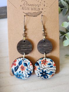 Handmade Wood Dangle Earrings! Gift your best friend these colorful wood boho dangle earrings and make her day. These circle earrings are created with natural wood in a denim stain on top and a colorful flower patterned wood circle for the bottom. The bottom is a pattern of florals. These are a perfect gift for any earring lover you know.  These lightweight, front facing earrings are created with Nickel free, hypoallergenic, stainless steel hooks that are great for sensitive ears. While the colo Blue Bohemian Earrings With Wooden Beads, Bohemian Blue Earrings With Wooden Beads, Bohemian Multicolor Wooden Bead Earrings, Multicolor Wooden Beads Dangle Earrings, Wood Dangle Earrings, Boho Earring, Flower Dangle Earrings, Spring Earrings, Floral Earrings