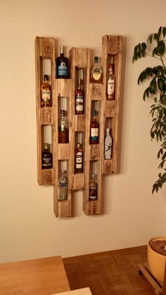 a wall mounted shelf with bottles on it