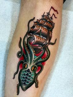 an octopus and ship tattoo on the leg