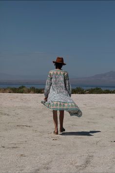 The Naomi wrap dress incorporates a mesmerizing display of floral print that can be worn as a dress or duster. This long-sleeved piece of artwork is a universal fit in a beautiful peach color. Color: Peach Sizes: One Size, Fits Size 2 to 10 100% Indian Cotton With a Lining Made in India Hippie Boho Dress With Floral Print For Garden Party, Hippie Spring Floral Print Midi Dress, Hippie Floral Print Midi Dress For Spring, Bohemian Flowy Floral Dress For Spring, Hippie Midi Dress With Floral Print For Spring, Vintage Floral Print Boho Dress For Vacation, Bohemian Boho Print Floral Dress For Beach, Feminine Floral Print Boho Dress For Garden Party, Hippie Floral Print Dress For Garden Party