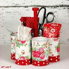 a red and white container filled with lots of crafting supplies sitting on top of a table