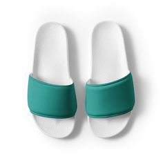 Women's teal slides A must-have for the summer: these women's slides. A pair of these will keep you comfy throughout your day of beach or pool activities, thanks to the cushioned upper strap and the textured footbed.  * Cushioned and durable faux leather upper strap * Lightweight polyurethane (PU) outsole * Contoured, textured footbed * Spot clean only * Printed, cut, and handmade * Blank product sourced from China Important: This product is available in the following countries: United States, C Green Non-slip Synthetic Slides, Comfortable Green Slides With Textured Footbed, Comfortable Green Synthetic Flip Flops, Comfortable Green Slide Slippers, Sporty Green Non-slip Slides, Green Casual Slides For Swimming, Green Casual Slides, Green Cushioned Synthetic Slippers, Green Slides With Textured Footbed