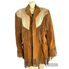 Pioneer Wear 70s Suede Fringe Jacket Med Large Made In The Usa A Great Western Jacket With Loads And Loads Of Fringe. Detailed With Blanket Tapestry On Yoke, Long Fringe, Inset Front Pockets, And Toggle Buttons. Fully Lined. Fabric: Leather Shell, Wool Loomed Blanket On Top And Back, Poly Satin Lining Measurements Are Approximate Length 30” Plus Another4” Fringe At End Armpit To Armpit 23” Shoulder To Shoulder 20” Sleeve Length 26” Any Questions Please Ask. Same Day Shipping Or Next Bundle Disco Western Style Brown Outerwear For Spring, Brown Western Outerwear For Spring, Spring Western Brown Outerwear, Retro Beige Blazer For Fall, Retro Beige Fall Blazer, Vintage Fringed Winter Outerwear, Vintage Brown Fringed Outerwear, Vintage Winter Outerwear With Fringe, Vintage Fringe Outerwear For Winter