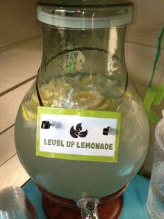 a jar filled with lemonade sitting on top of a table