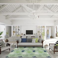 a living room filled with furniture and lots of windows