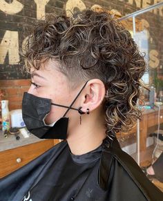 Female Mullet with Wavy Perms Curly Faded Mullet, Perm With Undercut, Curly Mullet Undercut, Sorry Curly Haircuts, Curly Hair Female Mullet, Curly Mullet Shaved Sides Men, Female Mullet Short Curly, Curly Mullet With Undercut, Short Curly Haircuts Undercut