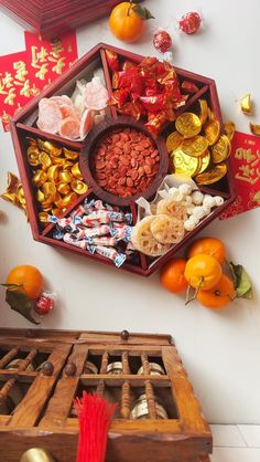 a wooden box filled with lots of different types of candies