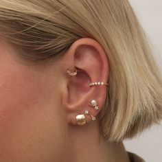 Bonjour every day in this luxe chubby hoop earring. Paris is a sleek and minimal hoop, uniquely set on a piercing stud for all day comfort and maximum impact. Created for you in solid 14 karat white gold, you'll want to wear this forever hoop always and never take them off, even when working out or in the shower. Minimalist Tarnish Resistant Ear Climbers For Everyday, Classic Hoop Ear Cuff Single Earring, Classic Hoop Single Ear Cuff, Trendy Small Hoop Single Ear Cuff, Dainty 14k Gold Ear Cuff For Everyday, Modern Small Hoop Internally Threaded Cartilage Earrings, Classic Internally Threaded Huggie Piercings, Classic Huggie Internally Threaded Piercings, Dainty Tarnish-resistant Ear Cuff For Everyday