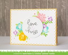 a card that says love and hugs with flowers on it