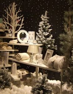 a christmas display in a store filled with snow