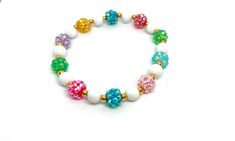 Adorable summer bracelet! 8mm white beads alternating with 4mm faux gold and bright multicolor rhinestone beads. Add a name or keep it simple! These are perfect for kids or adults! They make adorable tropical party favors, bachelorette party accessories, or just because! Colorful Beaded White Bracelets For Birthday, White Bracelets With Colorful Beads For Birthday, White Round Beads Stretch Bracelet For Birthday, White Stretch Bracelet With 8mm Beads For Birthday, Tropical Party Favors, Party Favors Bachelorette, Bachelorette Party Accessories, Summer Bracelet, Custom Bracelet