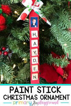 a christmas ornament hanging from a tree with the words happy hant stuck on it