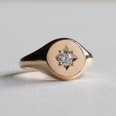 An etched starburst with an inlaid 3mm diamond accents this 14k yellow gold 14k fully hallmarked 3mm Diamond Clarity: SI-VS 1.5mm band width Monogram engraving available upon request. All of our jewelry will arrive in custom packaging ready for gift giving. FOLLOW US ON: Instagram: @roseandchoc Facebook: /Roseandchoc Pinterest: @Roseandchoc Yellow Gold Star-shaped Signet Ring For Anniversary, Star-shaped Diamond Ring With Single Diamond For Anniversary, Classic Yellow Gold Star-shaped Diamond Ring, Heirloom 14k Gold Star Rings, Vintage Star-shaped Anniversary Rings, Star-shaped Signet Ring In 14k Gold For Anniversary, Elegant Diamond Star-shaped Signet Ring, Elegant Diamond Star Signet Ring, Elegant Star-shaped Diamond Signet Ring