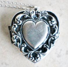 "Heart music box pendant. This heart shaped music box is inspired by the gorgeous music box pendants of era's gone by. A heart shaped locket has been adorned with a silver ox stamping of a lacey edged floral heart with a solid heart center. The lacey edged floral heart has been covered in a clear resin to give a glass like finish and preserve the beauty of this musical pendant. The locket opens and closes by pushing the little button on the side and reveals a tiny working music box that plays an Vintage Heart Necklace For Valentine's Day Keepsake, Vintage Nickel-free Heart Necklace As Gift, Vintage Heart Locket Necklace Nickel Free, Nickel-free Heart Locket Necklace For Wedding, Vintage Double Heart Locket Necklace Keepsake, Nickel Free Heart Locket Necklace For Wedding, Vintage Nickel-free Heart Necklace For Anniversary, Vintage Double Heart Locket Necklace, Vintage Open Heart Locket Necklace For Anniversary