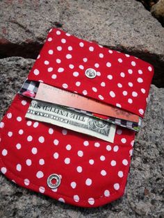 "A cherry business card holder with lots of storage. This small wallet has 2 slots for business cards, credit cards, ID's & folded cash. This little wallet will expand....I know because I use it for my business cards! The flap & backside is made of a pretty black & white gingham cotton print with bright red cherries. I have paired it with a red & white polka dot print. It stays secure with a pearl snap (which may vary in color). It has a layer of sturdy interfacing & has been Pocket Wallet, Business Card Holder, Business Card Holders, Small Wallet, Polka Dot Print, Dot Print, My Business, White Polka Dot, Bright Red