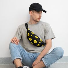 Keep your valuables close and secure while you immerse yourself in the festival vibes with the Trippie Yellow Smiley Fanny Pack. Designed for ravers who prioritize safety without sacrificing style, this fanny pack is the quintessential companion for any music event. Its snug fit and hands-free design mean your phone, wallet, and essentials stay with you, safe from the bustling crowds. • Made with 100% polyester, combining durability with a lightweight, water-resistant finish.• Features a practic Black Casual Chest Bag For Streetwear, Casual Black Chest Bag For Streetwear, Casual Black Belt Bag For Summer, Summer Black Belt Bag For Everyday Use, Black Belt Bag For Everyday Summer Use, Trendy Black Belt Bag For Streetwear, Black Belt Bag For Everyday Use In Summer, Black Casual Bags For Festivals, Casual Black Bag For Festival