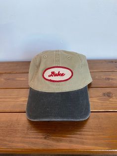 100% Polyester One Size Fits Most Vintage Brown Dad Hat With Curved Bill, Vintage Beige Cotton Hat, Casual Brown Hat With Embroidered Logo, Vintage Brown Cotton Trucker Hat, Casual Trucker Hat Baseball Cap Made In Usa, Vintage Khaki Baseball Cap, Vintage Dad Hat For Everyday, Casual Adjustable Hats Made In Usa, Retro Cotton Hats For Outdoor