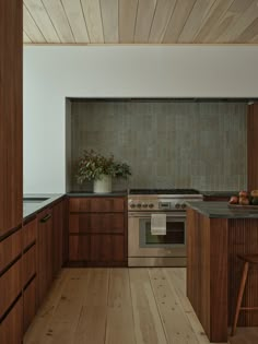 a kitchen with wooden cabinets and an oven