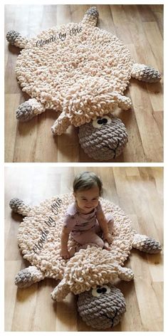 a baby sitting on top of a sheep rug