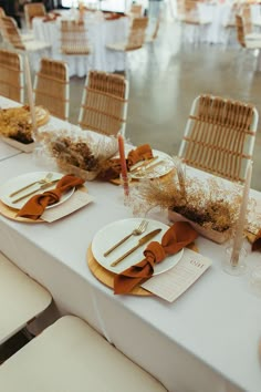 the table is set up with place settings and napkins for guests to enjoy their meal