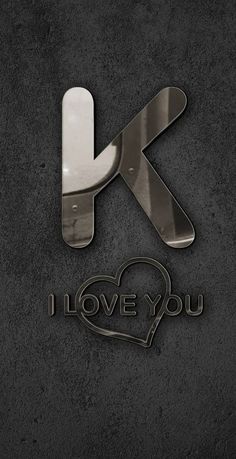 the letter k is made out of metal and has an i love you design on it