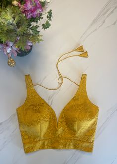 Fitted Yellow Sleeveless Blouse, Yellow Padded Blouse For Party, Yellow Sleeveless Blouse For Party, Elegant Sleeveless Gold Vest, Gold Sleeveless Blouse For Summer, Elegant Sleeveless Yellow Blouse, Elegant Yellow Sleeveless Blouse, Elegant Sleeveless Tank Top For Festive Occasions, Yellow Sleeveless Tank Top For Party