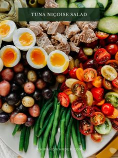 an assortment of vegetables and eggs on a plate