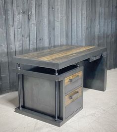 a desk with two drawers and a wooden top