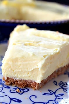 a piece of cake sitting on top of a blue and white plate next to another pie