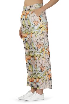 Introducing our Cotton Schiffli All-Over Floral Printed Pants - a delightful fusion of comfort and style that embraces the beauty of floral patterns. These pants are designed to make a statement while ensuring you stay relaxed and chic. Crafted from high-quality cotton Schiffli fabric adorned with an exquisite all-over floral print, these pants capture the essence of natural beauty. The fabric is not only breathable but also adds a touch of elegance to your ensemble. The wide-leg design provides Floral Print Ankle-length Summer Pants, Ankle-length Floral Print Summer Pants, Summer Floral Print Cotton Wide Leg Pants, Cotton Wide-leg Pants With Floral Print, Cotton Printed Pants For Vacation, Summer Floral Print Ankle-length Pants, Summer Floral Print Ankle-length Bottoms, Floral Print Wide Leg Pants For Vacation In Spring, Floral Print Wide Leg Pants For Spring Vacation