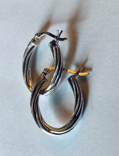 "This is a simple, versatile pair of sterling silver (.925) hoop earrings. Material(s): Sterling Silver (.925) Total weight: 1.7 grams Flaws (if any): None to mention Marking(s): \".925\" (translating to \"sterling silver\") Measurements: These earrings are 7/8 of an inch in height and 3/4 of an inch in width. If you have any questions about this pair of earrings, please do not hesitate to contact us! ♥" Earrings Vintage, Vintage Earrings, Silver 925, Etsy Vintage, Leather Bracelet, Hoop Earrings, 925 Sterling Silver, Sterling Silver, Silver