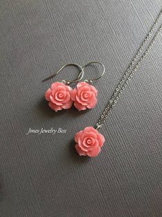 So pretty! Light coral pink rose necklace. Detailed 15mm resin flower hangs on a dainty but sturdy stainless steel chain. This necklace is 18'' with lobster clasp. *15mm resin flower *Stainless steel chain, clasp, and wire *Silver plated brass pin *Handmade with love <3 Like Jmesjewelrybox on Facebook for updates on new jewelry, upcoming sales, and giveaways! Plus Facebook fans save 5% :D Find the coupon code on Jmesjewelrybox's cover photo https://www.facebook.com/Jmesjewelrybox Rose Jewelry Flower, Rose Earring, Collar Rosa, Wire Clasp, Earrings Outfit, Earring And Necklace Set, Resin Rose, Polymer Clay Flower Jewelry, Coral Rose