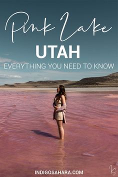 a woman standing in shallow water with the words pink lake utah everything you need to know