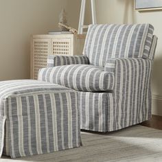 a striped chair and ottoman in a living room